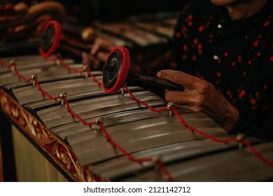 Indonesian musical instruments, Gamelan, drums and gongs. Background, space cross. - Shutterstock ID 2121142712