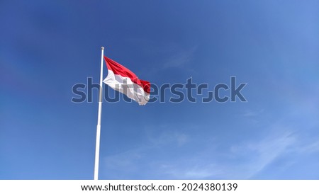 The Indonesian national flag flutters to welcome the commemoration of Indonesia's independence day 17 August.