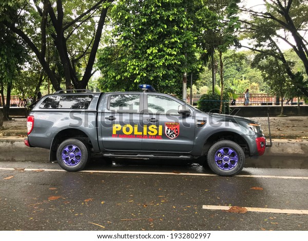 An\
Indonesian police patrol vehicle was parking on the road.\
Banjarmasin, South Kalimantan, Indonesia 6 March\
2021