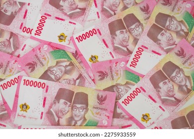 Indonesian rupiah banknotes series with the value of one hundred thousand rupiah IDR 100.000 issued since 2004, Indonesian rupiah for background

 - Shutterstock ID 2275933559
