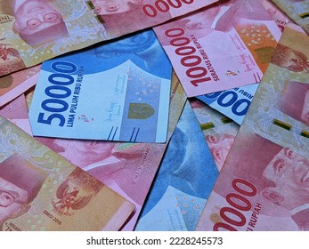 Indonesian rupiah currency notes in one hundred thousand and five thosand  isolated against white background