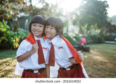 indonesian school student holding flag during independence day. - Shutterstock ID 2016514052