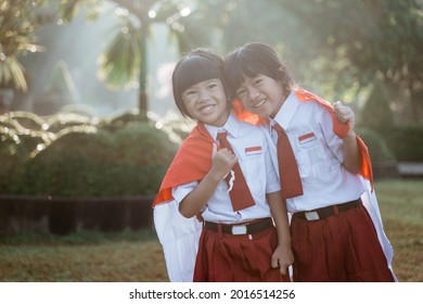 Indonesian School Student Holding Flag During Independence Day.