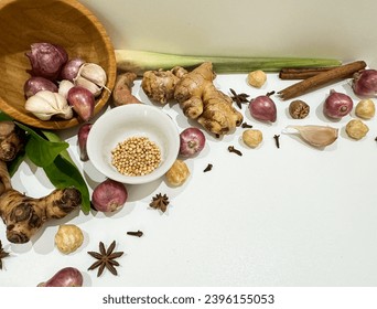 Indonesian spices,ginger, garlic, candlenut, cloves, star anise, cinnamon stick,red onion, turmeric, galangal, lemongrass,used in Indonesian cooking and herbal remedies.isolated on white.copy space. - Powered by Shutterstock