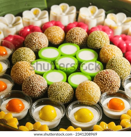 Indonesian traditional cakes or traditional market snacks, which are neatly arranged in a row with a variety of beautiful shapes and colors