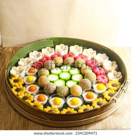 Indonesian traditional cakes or traditional market snacks, which are neatly arranged in a row with a variety of beautiful shapes and colors