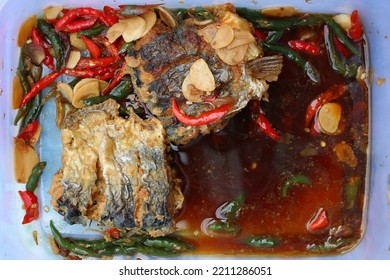 Indonesian traditional food named "ikan tongkol kecap kuah pedas" i.e. mackerel tuna fish cooked with soysauce and chili peppers   