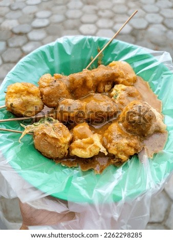 Indonesian traditional snack, pentol. Pentol made of eggs and vegetables. Very delicious enjoyed with peanut sauce Foto d'archivio © 