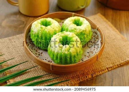 Indonesian Traditional steamed cake Kue Putu Ayu, made from rice flour, grated coconut, pandanus and suji leaves. 