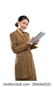 Indonesian Woman In Civil Servant Uniform With Thumbs Up While Using Tablet