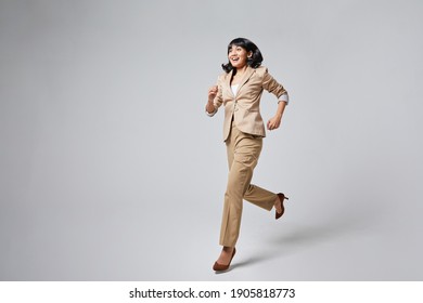 A Indonesian Woman Running In A Suit