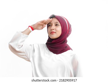 Indonesian women wearing red and white clothes are doing respect on Indonesia's independence day, isolated on white background