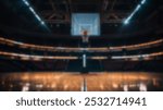 An indoor basketball court with dramatic lighting, shot from the center court towards the hoop. Empty arena, perfect for basketball events or background use.