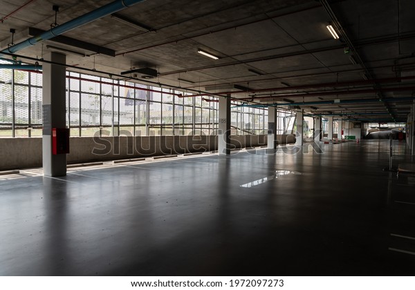 Indoor car parking\
is empty. People don\'t come to the mall, leaving the parking lot\
empty. in covid\
situation.