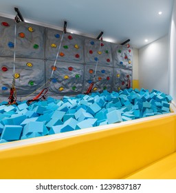 Indoor Children Rock Climbing Facility, Blue Sponge On The Ground