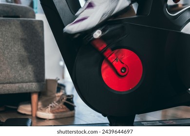 Indoor cycling spinning fast on a black and red bike feet close up still shoes - Powered by Shutterstock