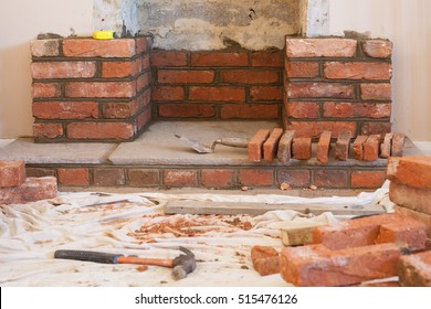 Indoor DIY Project: Building Fireplace In The House: Laying Bricks. Selective Focus