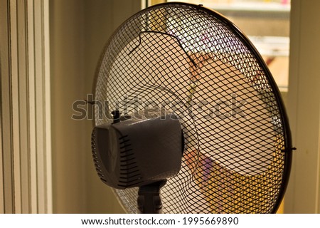 An indoor electric fan in the bedroom (Marche, Italy, Europe)