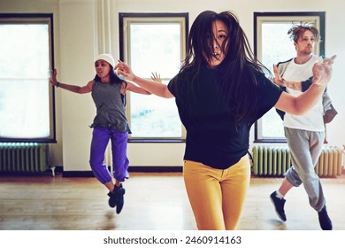 Indoor, hip hop and group of dancers for action, breakdance or performance together for rehearsal. Inside, practice or freestyle of talented people with skill, exercise or energy for entertainment - Powered by Shutterstock