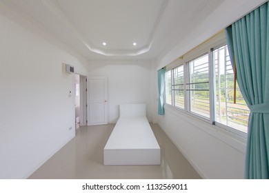 Indoor of a little modern white environmental atmospheric  pre - decoration  bedroom on upstairs in a countryside private residential house