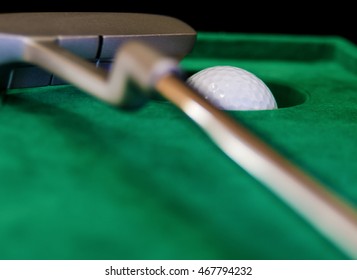 Indoor Mini Golf, Ball Pocket And Putter On Green Cloth