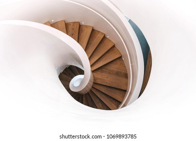 Indoor modern spiral staircase in white. Top view. - Powered by Shutterstock