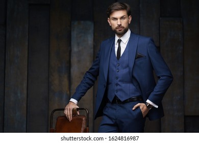 indoor photo of young handsome stylish businessman wearing suit - Shutterstock ID 1624816987