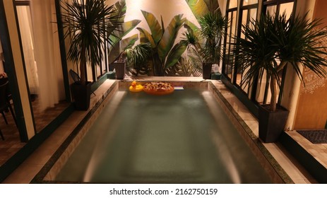 Indoor Pool With Decorations At Night