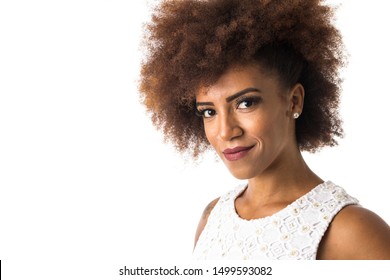 Indoor portrait of afro hairstyle black woman looking happily in camera. Isolated on white background.