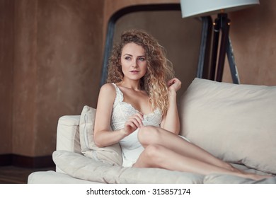 Indoor Portrait Of Young Blond Sexy Woman In Sleepwear