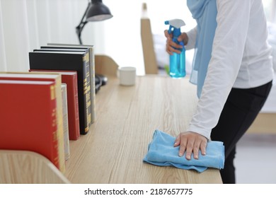 Indoor Shot Active Young Beautiful Asian Housewife Woman Holding Cleaning Spray, Washing Table. Portrait Cute Girl With Happy Emotional Cleaning Bedroom In New Apartment After Moved In. 