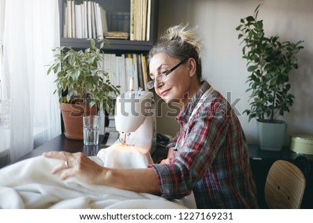 Similar – Image, Stock Photo Girl stiring coffee and looking her tablet