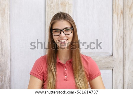 Similar – Image, Stock Photo Rectangular portrait of a young woman in front of a green wall