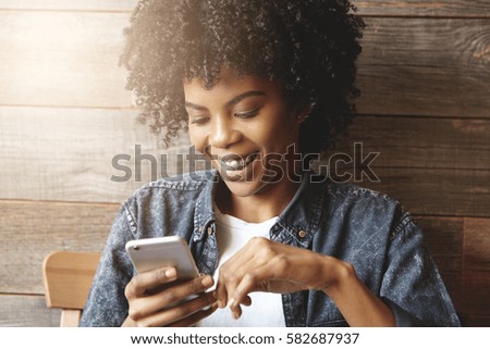 Similar – Image, Stock Photo black women friends using smartphone having fun in the city