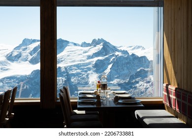 Indoor Shot Of The Table Decoration Inside Of The Restaurant That Have Exotic Scenery Of Titlis Ice Mountain In Switzerland During Summer Season. Travel Destination, No People.