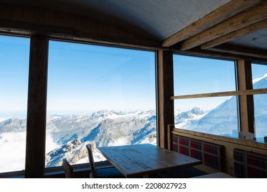 Indoor Shot Of The Table Decoration Inside Of The Restaurant That Have Exotic Scenery Of Titlis Ice Mountain In Switzerland During Summer Season. Travel Destination, No People.