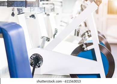 Indoor Stationary Bikes For Spinning Cycling Classes. Spinning Class With Empty Bikes. Close Up Of Gym Bikes.