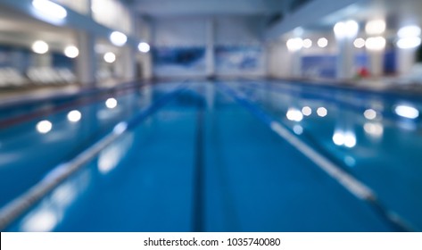 Indoor Swimming Pool In Blur Background. Abstract Blurry Swimming Pool In Fitness Centre