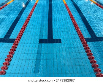 Indoor swimming pool with lane lines and reflection - Powered by Shutterstock