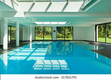 Indoor Swimming Pool Of A Modern House With Spa