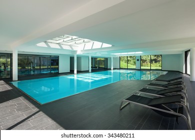 Indoor Swimming Pool Of A Modern House With Spa