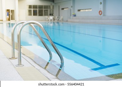 Indoor swimming pool with stair in a building