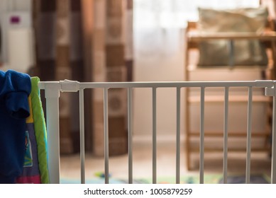 Indoor View Baby Safety Gate With Feeding Child Sit On Background