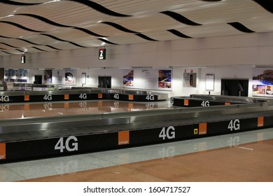 Indoor View Of Blaise Diagne International Airport, Near The Town Of Thies, Senegal, West Africa. October, 13, 2019. Large Modern Hall With Passengers Near The Conveyor Belt. Curvy Ceiling. 