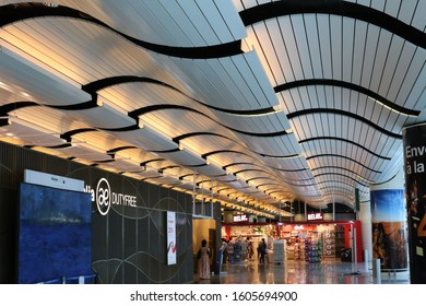 Indoor View Of Blaise Diagne International Airport, Located Near Dakar City, Thies Region, Senegal, West Africa. October, 26, 2019. Long Modern Hall With A Curved Colored Ceiling. Bright Grey Floor.