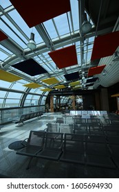 Indoor View Of Blaise Diagne International Airport, Located Near Dakar City, Thies Region, Senegal, West Africa. October, 26, 2019. Long Modern Hall With A Curved Colored Ceiling. Bright Grey Floor.