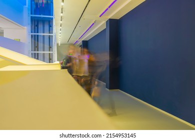 Indoors Architecture, Perspective View With Blurred Silhouettes Of People. Abstract Architectural Background