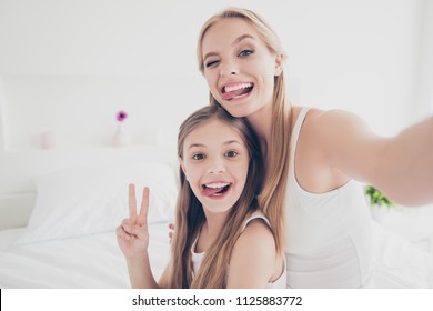 Indoors Domestic Lifestyle Grimace Fooling Concept. Close Up Portrait Of Cute Cool Funky Funny Beautiful Pretty Excited Rejoicing Delightful Mom And Offspring Making Taking Self Picture In Bed Room