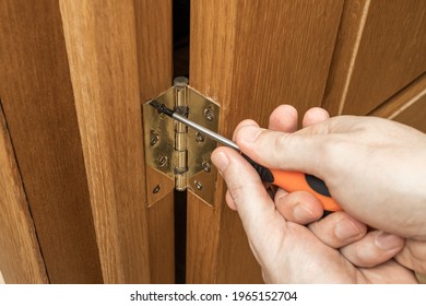indoors door loop repair or fix. handyman carpenter adjusting creak hinge.