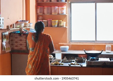 Indore, India - 11 10 2018: Preparing Ingredients And Cooking Meal In Indian Home Kitchen